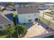 Aerial view of home showcases the private, fenced yard and brick patio with fire pit at 9228 Halsey Dr, Groveland, FL 34736