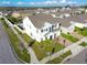 A view of a suburban home with a driveway and manicured lawn in a quiet neighborhood at 9228 Halsey Dr, Groveland, FL 34736