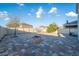 Spacious backyard with custom brick patio, fire pit, basketball hoop, and privacy fence at 9228 Halsey Dr, Groveland, FL 34736