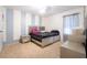Comfortable bedroom with a queen-sized bed and modern decor, providing a relaxing space at 9228 Halsey Dr, Groveland, FL 34736