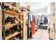 Walk-in closet providing ample storage with shelving and hanging racks for organized wardrobe at 9228 Halsey Dr, Groveland, FL 34736