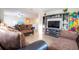 Open living area featuring comfortable seating, a media center, and plenty of room for Gathering gatherings and entertainment at 9228 Halsey Dr, Groveland, FL 34736