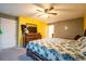 Bright main bedroom with a beautiful bed, ample lighting, and dark wood furniture at 9228 Halsey Dr, Groveland, FL 34736