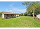 Spacious backyard with a patio, offering plenty of room for outdoor activities and relaxation at 9236 Baton Rouge Dr, Orlando, FL 32818