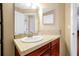 Bathroom featuring a sink with light colored countertop and wooden cabinet at 9236 Baton Rouge Dr, Orlando, FL 32818