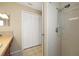 Bathroom showing tile shower, white doors, and tiled floors at 9236 Baton Rouge Dr, Orlando, FL 32818