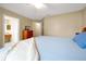 Shot of a bedroom with carpeted floors, a bed, and closet space at 9236 Baton Rouge Dr, Orlando, FL 32818