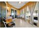 Bright sunroom with tile flooring, large windows, and comfortable seating at 9236 Baton Rouge Dr, Orlando, FL 32818