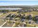 Aerial view of the home showcasing a beautiful lakeside community at 938 Braewood Dr, Clermont, FL 34715