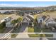 Aerial view of a home with well-manicured landscaping in a desirable community near a lake at 938 Braewood Dr, Clermont, FL 34715