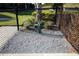 Dog park featuring a water fountain, gravel, and lush landscaping at 938 Braewood Dr, Clermont, FL 34715