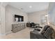 This is a living room with a television and a reclining sofa as well as an office area at 938 Braewood Dr, Clermont, FL 34715