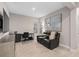 This is a living room with a television and a reclining sofa as well as an office area at 938 Braewood Dr, Clermont, FL 34715