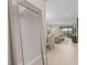Bright and airy living room with wood floors, a large mirror, and views of the open-concept living space at 938 Braewood Dr, Clermont, FL 34715