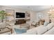 Elegant living room with contemporary decor, stylish furnishings, and an open layout with a dining area at 938 Braewood Dr, Clermont, FL 34715