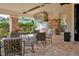 Community outdoor kitchen featuring stainless steel appliances, a gas grill, and stone accents at 938 Braewood Dr, Clermont, FL 34715
