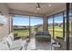 Relaxing screened-in patio with comfortable seating and views of the well-maintained backyard and landscape at 938 Braewood Dr, Clermont, FL 34715