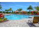 Community pool featuring cabanas and landscaping and a zero entry access point at 938 Braewood Dr, Clermont, FL 34715