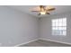 Bedroom with ceiling fan, window and light grey flooring at 1015 S Hiawassee Rd # 3514, Orlando, FL 32835