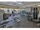 Bright fitness center with treadmills, elliptical machines, weights, and various exercise equipment at 1015 S Hiawassee Rd # 3514, Orlando, FL 32835