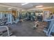 Well-equipped gym featuring modern machines, weights, mirrors, and ample workout space at 1015 S Hiawassee Rd # 3514, Orlando, FL 32835