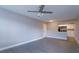 Open floor plan living room with fan and view of the kitchen at 1015 S Hiawassee Rd # 3514, Orlando, FL 32835