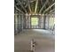 Spacious room with steel framing and a window, showcasing the construction phase at 1017 Randall St, Orlando, FL 32805