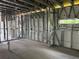 This in-progress home features metal framework walls and insulation with plumbing and electrical in the interior at 1017 Randall St, Orlando, FL 32805