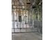 This in-progress home features metal framework walls on the interior with plumbing and electrical at 1017 Randall St, Orlando, FL 32805