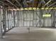 This in-progress home features metal framework walls and insulation with plumbing and electrical in the interior at 1017 Randall St, Orlando, FL 32805