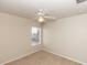 Carpeted bedroom featuring a ceiling fan and natural light from a single window at 1201 Berkman Cir, Sanford, FL 32771