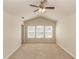 Bedroom with vaulted ceiling, neutral carpet, and three windows for natural light at 1201 Berkman Cir, Sanford, FL 32771