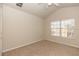 Bedroom with neutral carpet, window and a ceiling fan at 1201 Berkman Cir, Sanford, FL 32771