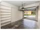 A bright open garage space with built-in shelving and open door at 1201 Berkman Cir, Sanford, FL 32771