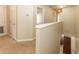 Upstairs hallway with carpet, neutral paint, doors leading to bedrooms and bathrooms at 1201 Berkman Cir, Sanford, FL 32771