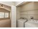 Laundry room featuring a washer, dryer, and wire shelving at 1201 Berkman Cir, Sanford, FL 32771