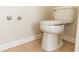 Close up on a clean white toilet in a neutral bathroom with tile floors at 1201 Berkman Cir, Sanford, FL 32771