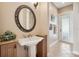 Bathroom featuring decorative fixtures and trim, a sink basin and towel bars at 1220 Lake Mills Rd, Chuluota, FL 32766