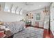 Bedroom featuring hardwood flooring, a decorative chandelier, and a ceiling fan at 1220 Lake Mills Rd, Chuluota, FL 32766