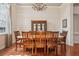 Formal dining room boasting a large wooden table and elegant chandelier at 1220 Lake Mills Rd, Chuluota, FL 32766