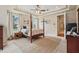 Spacious main bedroom showcasing a tray ceiling, natural light, and relaxing ambiance at 1220 Lake Mills Rd, Chuluota, FL 32766