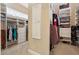 Organized walk-in closet with custom shelving, hanging rods, and ample storage space at 1220 Lake Mills Rd, Chuluota, FL 32766