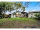 Spacious backyard features a shed, covered patio, and green lawn at 1320 Golfview St, Orlando, FL 32804