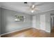 Neutral bedroom offering hardwood floors, a ceiling fan, natural light and neutral paint at 1320 Golfview St, Orlando, FL 32804