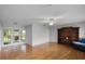 Living room featuring hardwood floors, built in bookshelves, with direct access to the porch at 1320 Golfview St, Orlando, FL 32804