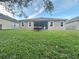 Spacious backyard with a screened-in patio and well-maintained lawn at 13226 Zori Ln, Windermere, FL 34786