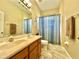 Bathroom featuring a double vanity with matching cabinets and neutral walls and floors at 13226 Zori Ln, Windermere, FL 34786