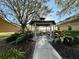 A gazebo with seating and landscaping offers a scenic relaxation spot outdoors at 13226 Zori Ln, Windermere, FL 34786