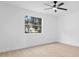 This light-filled bedroom has a ceiling fan and light wood-look flooring at 137 Stevens Ave, Chuluota, FL 32766