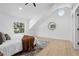 Bright main bedroom featuring a vaulted ceiling and a view of the backyard through a window at 137 Stevens Ave, Chuluota, FL 32766